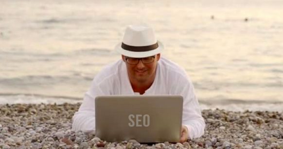 man with white hat doing SEO